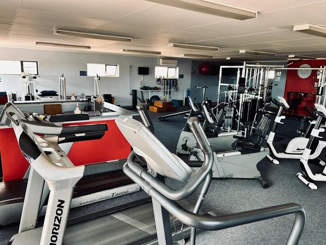 Exercise bikes and rehabilitation equipment inside the Hartenbos practice